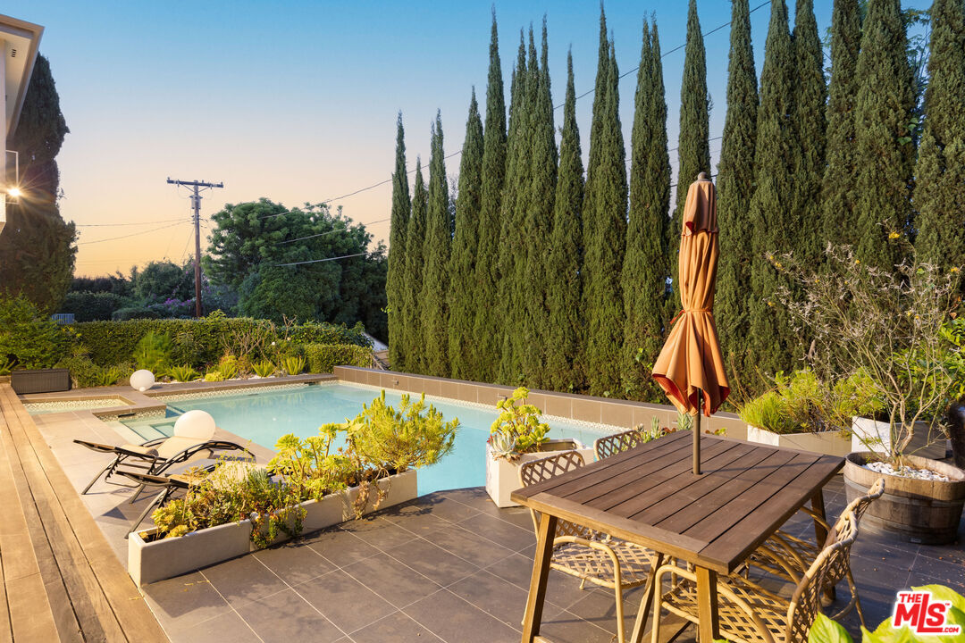 A Serly Andrias listing, pool and garden